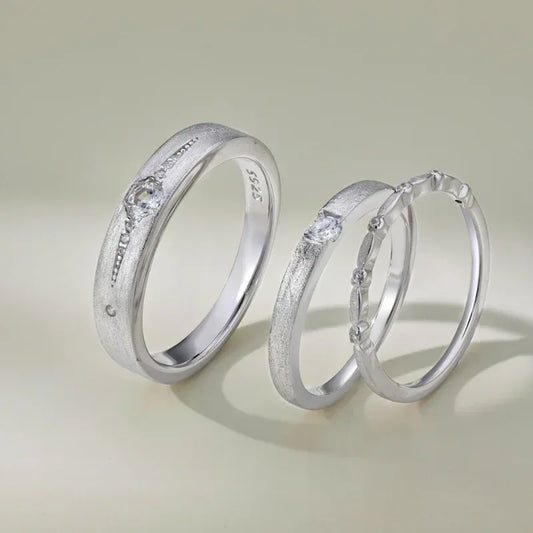 Rhodium silver tone couple engagement rings with CZ side stones