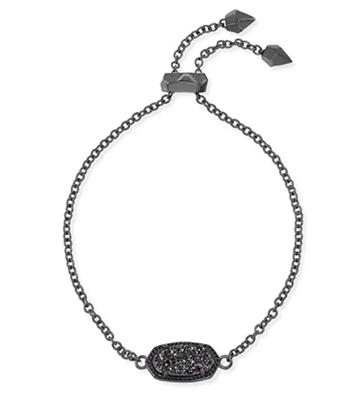 Black chain bracelet with dark oval pavé gemstone centerpiece and small square charms