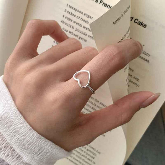 Adjustable minimalist hollow heart open ring, white gold tone, heart outline front view