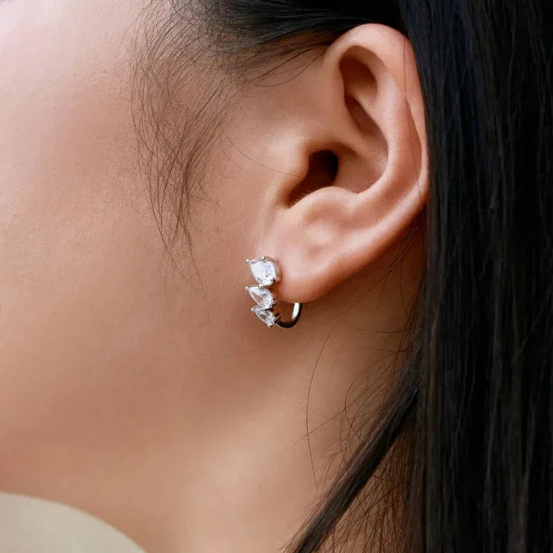 White gold hoop stud earrings with three clear zirconia stones