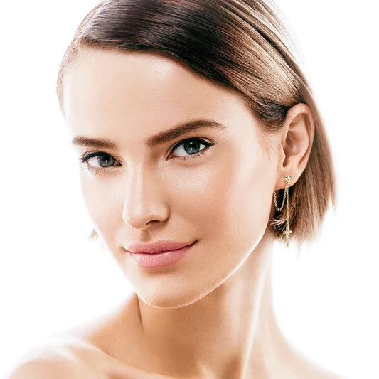 Cross drop earrings on model, gold posts with round stone tops and chain drops
