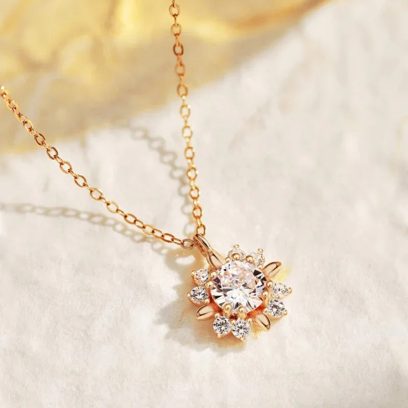 Rose gold CZ flower pendant necklace with large round center stone and petal settings
