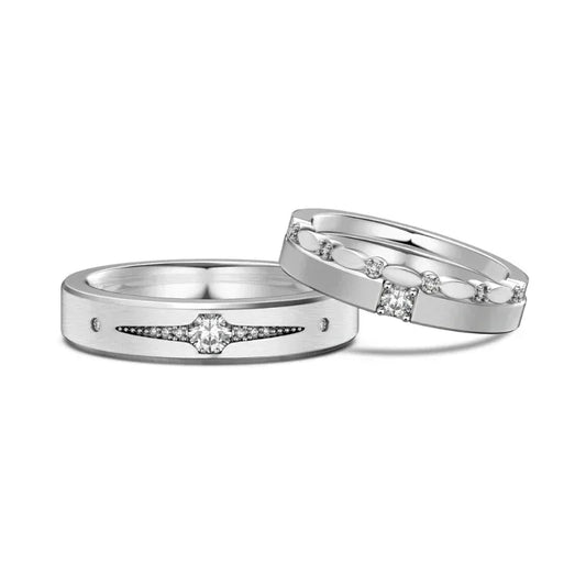 Silver tone couple engagement rings with prong-set center CZ and pave details