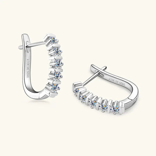 Silver huggie hoop earrings with a row of five round stones along the hoop