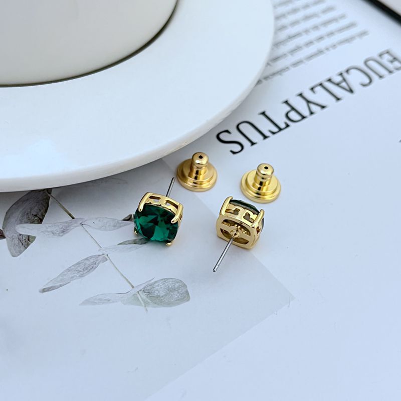 Gold-tone square stud earrings with green rhinestone squares and post backs