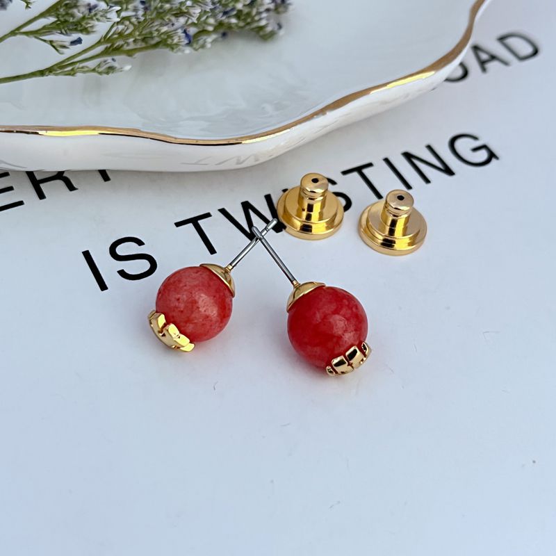 Red round pearl geometric stud earrings with gold-tone posts and backs