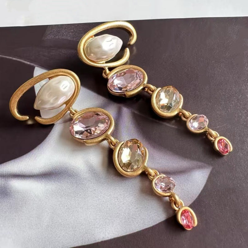Oscar de la Renta long crystal drop earrings with pink and champagne faceted stones, gold tone.