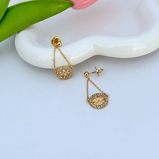 Gold hoop drop earrings with round pavé rhinestone charm and chain, post back detail