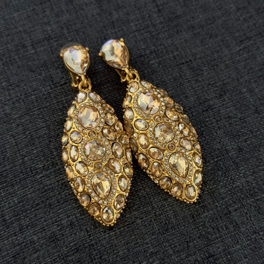 Champagne gold clip-on teardrop earrings with round crystal-studded panels