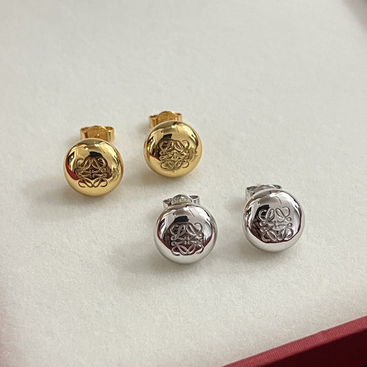 Round bean earrings in gold and silver tones, engraved logo medallions