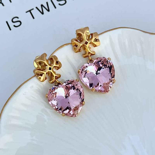 Light purple heart-shaped acrylic drop earrings with gold-tone floral frame