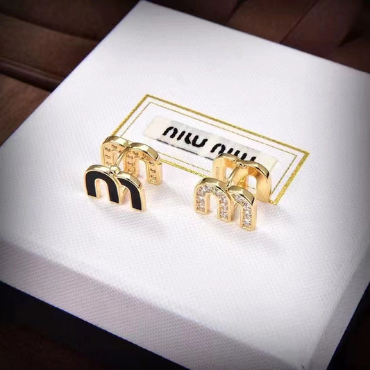 Miu Miu enamel M-shaped stud earrings, gold with black enamel and clear crystal details