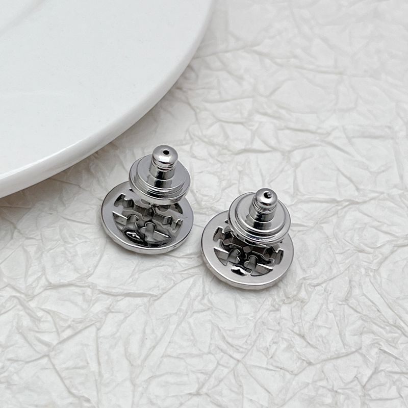 Silver-tone round stud earrings with openwork logo, rhinestone rim, and visible back posts