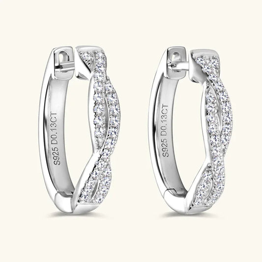 White gold twisted hoop earrings with pavé moissanite stones, hinged clasp