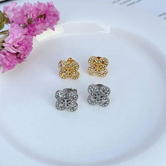 Gold and white gold four-leaf clover stud earrings with crystal accents