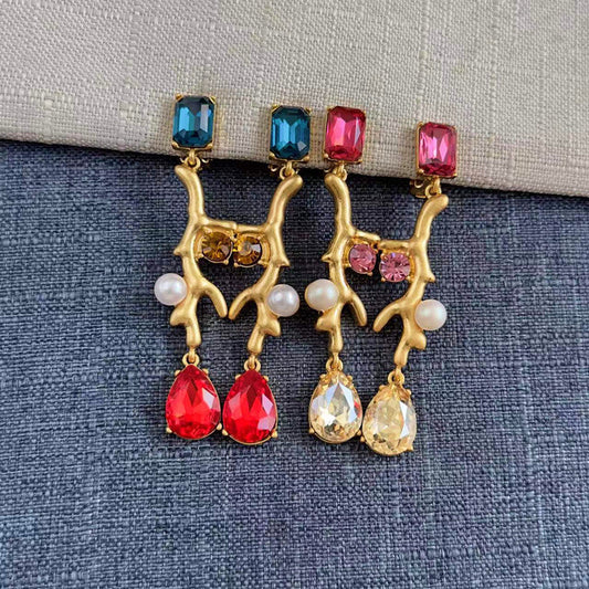 Gold-tone coral branch clip-on earrings with blue and pink stones, red teardrops, white pearls
