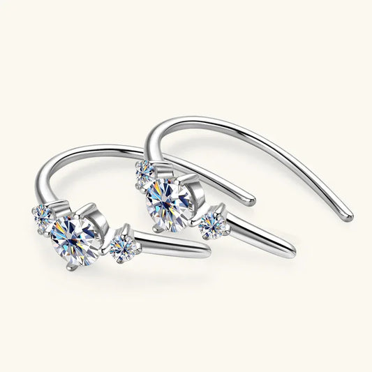 Silver-tone three-stone moissanite hook earrings with three round clear stones, open hoop