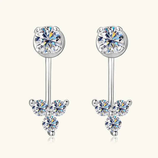 Silver-tone dangle earrings with three round moissanite-style stones and french-hook backs.