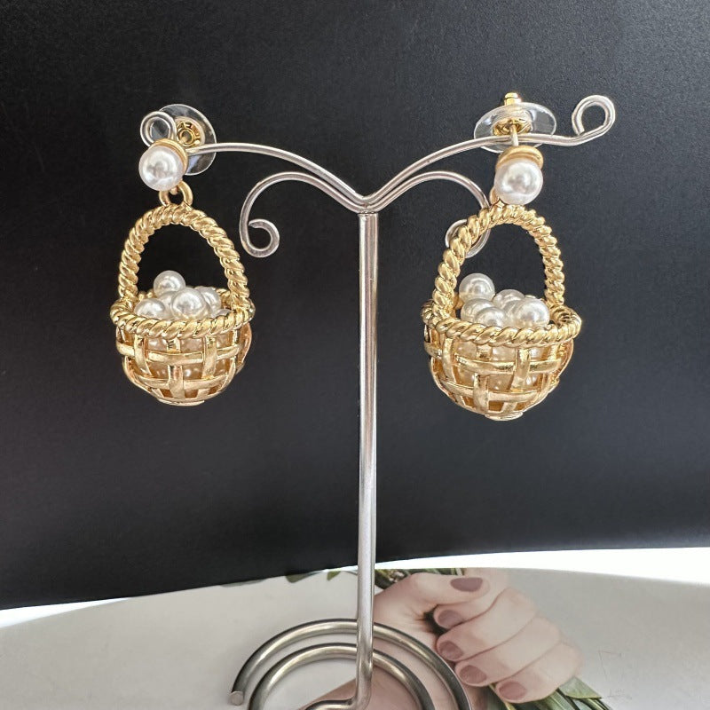 Gold basket stud earrings with clustered pearls and silver-toned hooks