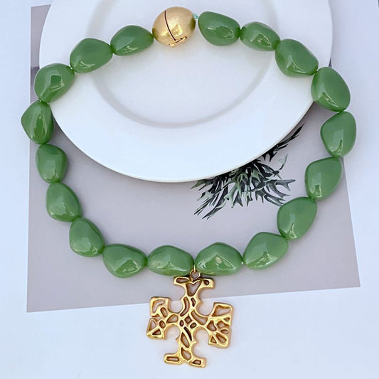 Green acrylic bead necklace with gold logo pendant and gold accent beads