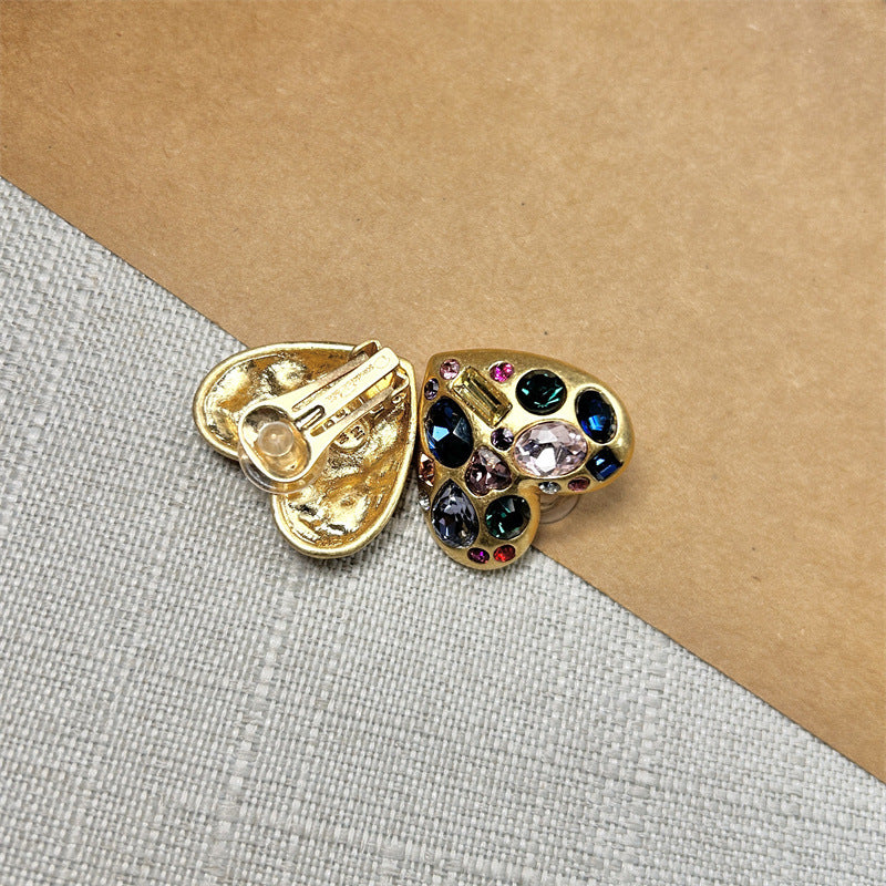 Heart-shaped crystal stud earrings, gold tone with butterfly back and multicolor stones