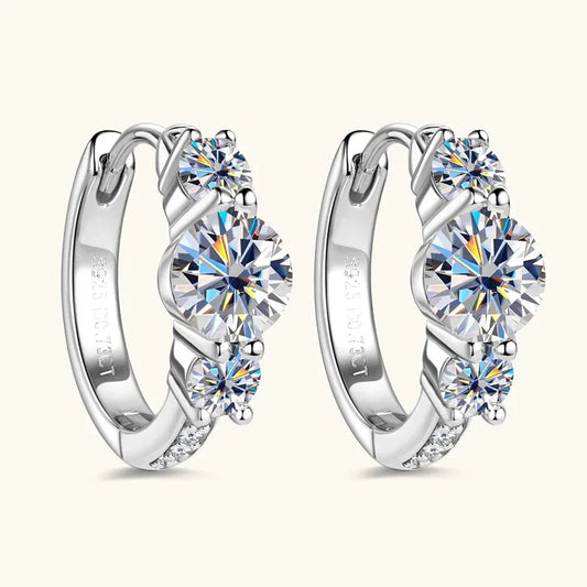 Silver three-stone hoop earrings with three round crystal stones and small accent stones
