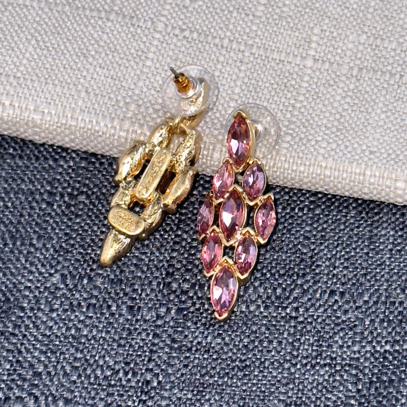 Rose pink diamond-shaped rhinestone earrings with gold-tone settings and clear stud backs