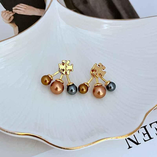 Gold-tone logo stud earrings with three dangling beads in brown, dark, and gold tones