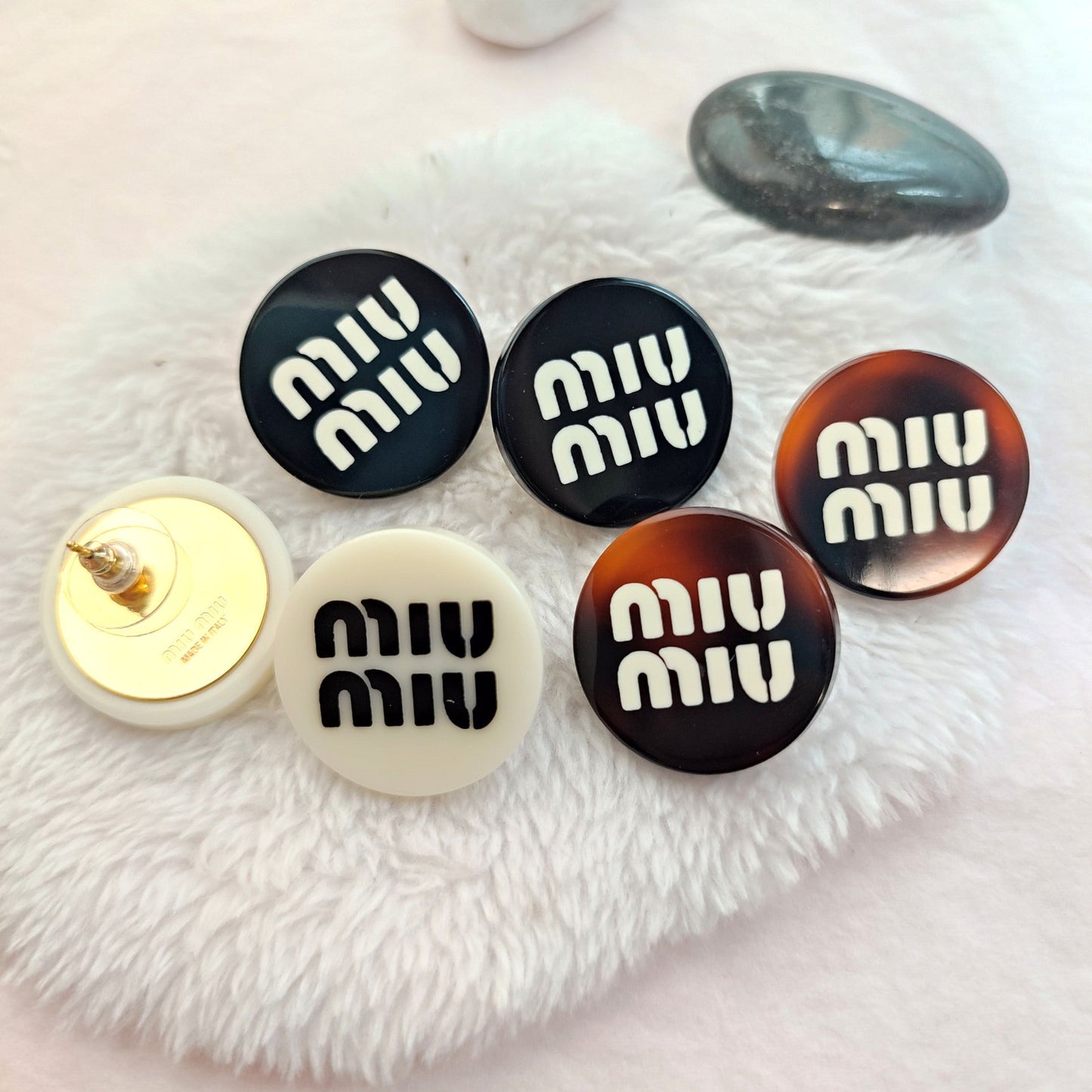 Miu Miu round resin button stud earrings set in black, white and amber