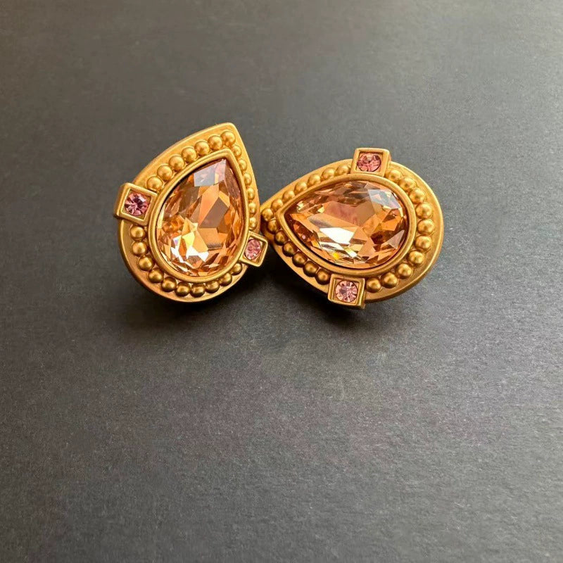 Gold-tone heart-shaped crystal clip-on earrings with amber oval stones