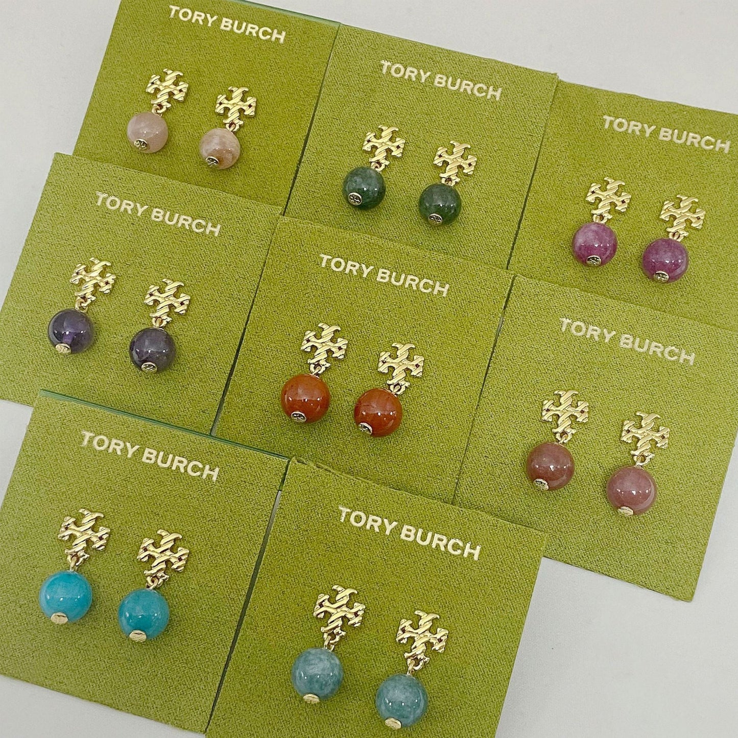 Assorted color agate pendant earrings set with gold-tone leaf motifs and round stones