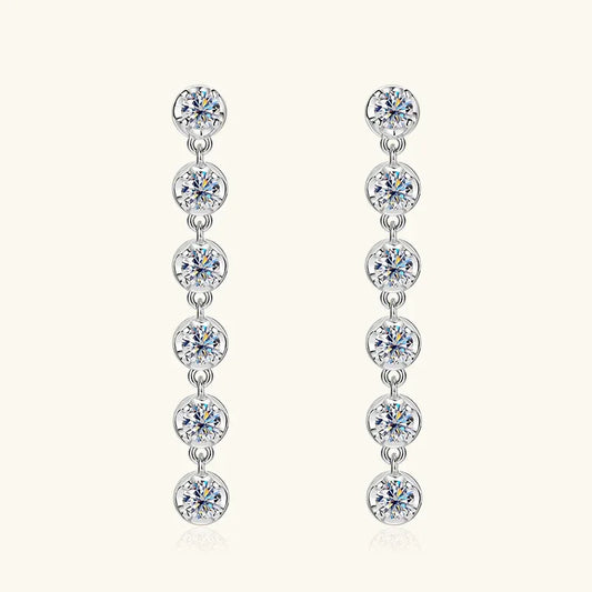 White gold linear drop earrings with five round moissanite stones on linked drops
