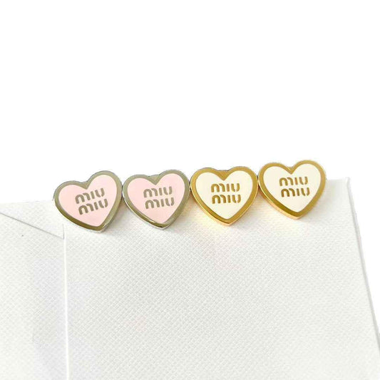 Heart enamel stud earrings, mix of silver-tone and gold-tone with pink enamel hearts