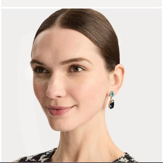 Teardrop-cut diamond stud earrings with blue square tops and blue teardrop stones