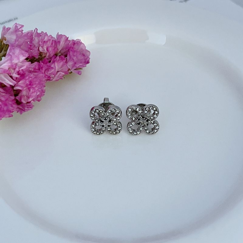 White gold four-leaf clover stud earrings with pavé crystal flower-like petals