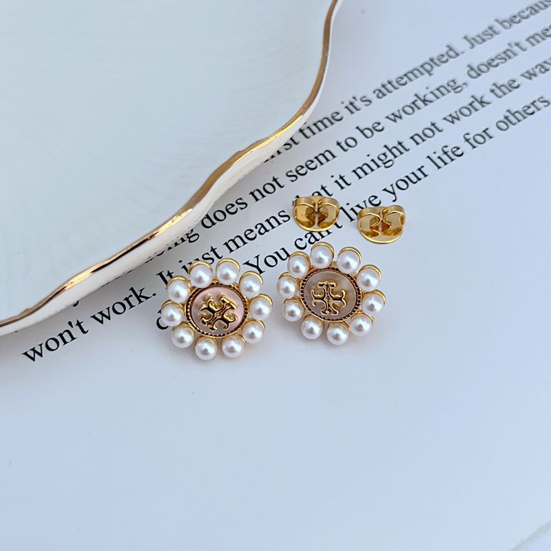 Gold faux pearl sunflower stud earrings with round center medallion and post backs