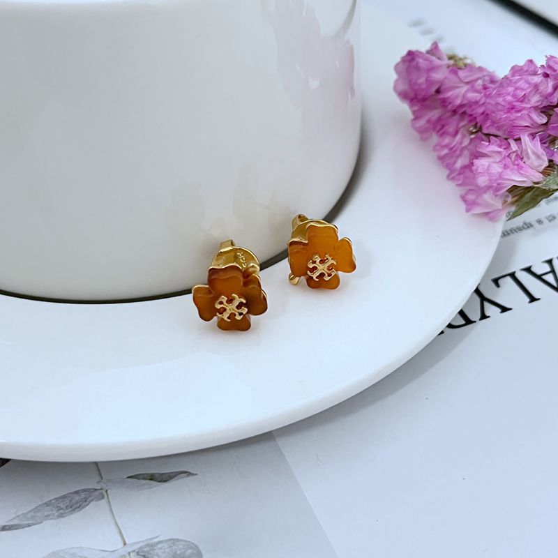 Four-leaf clover stud earrings, amber petals with gold-tone detail
