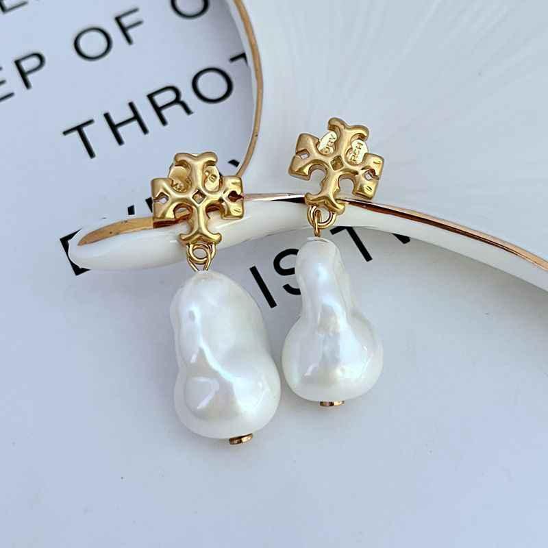 Gold baroque cross earrings with two white teardrop pearl drops