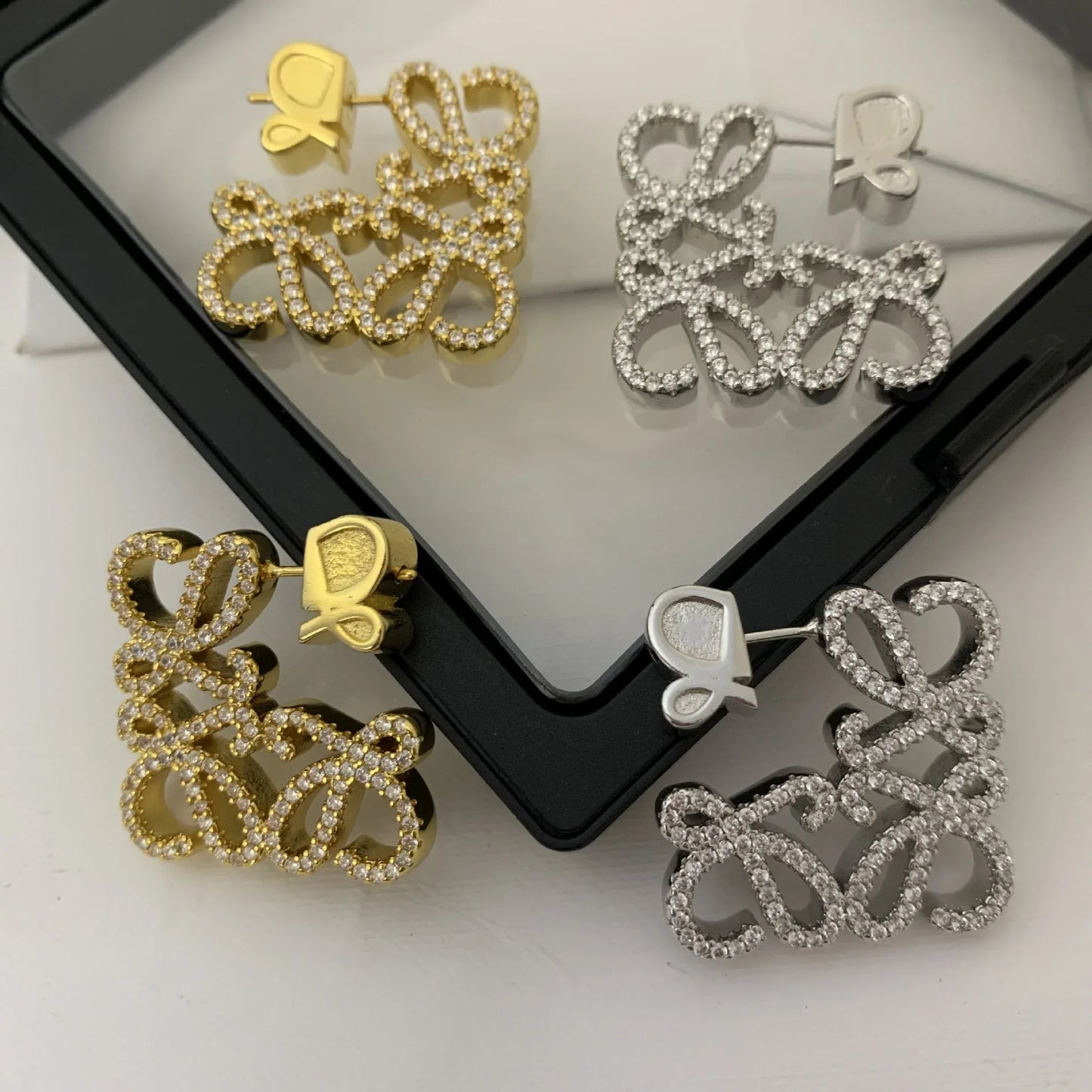 LOEWE Geometric Hollow Diamond Stud Earrings for Women - JIMMY JEWELRY 01