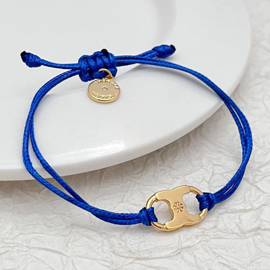 Tory Burch Dopamine cord bracelet in royal blue with gold enamel logo charm