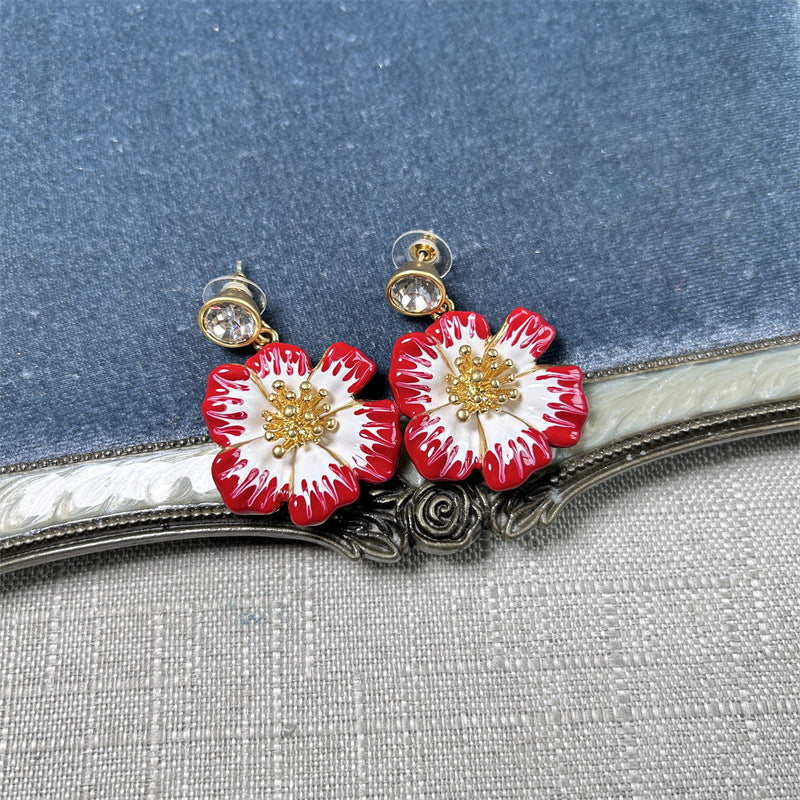 Vintage enamel cherry blossom earrings with red and white flower petals, gold posts