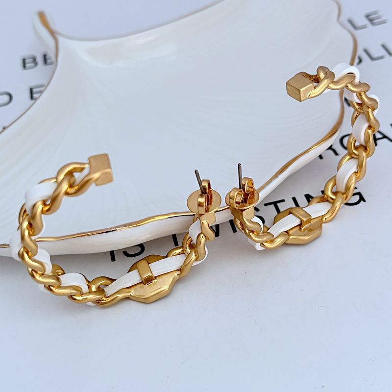 Leather-woven logo hoop earrings with linked gold-tone hardware and small logo plaques