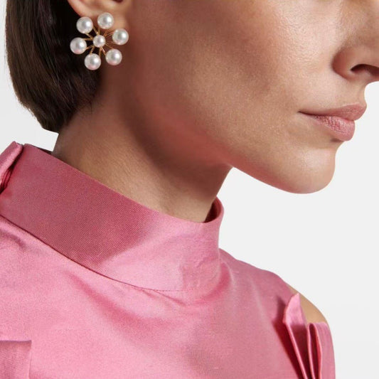 Gold-tone pearl cluster earrings with round pearl blossoms at the ear