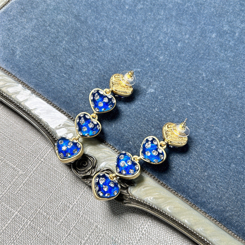 Oscar de la Renta heart drop earrings, blue enamel hearts with gold-tone frames and rhinestones