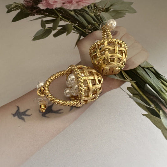 Gold basket stud earrings with braided rim and white pearl top and side accents