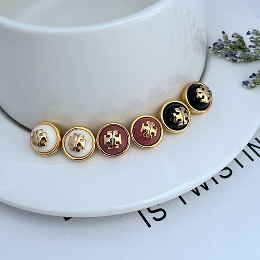 Gold-tone round resin logo stud earrings, mixed white and burgundy and dark faces