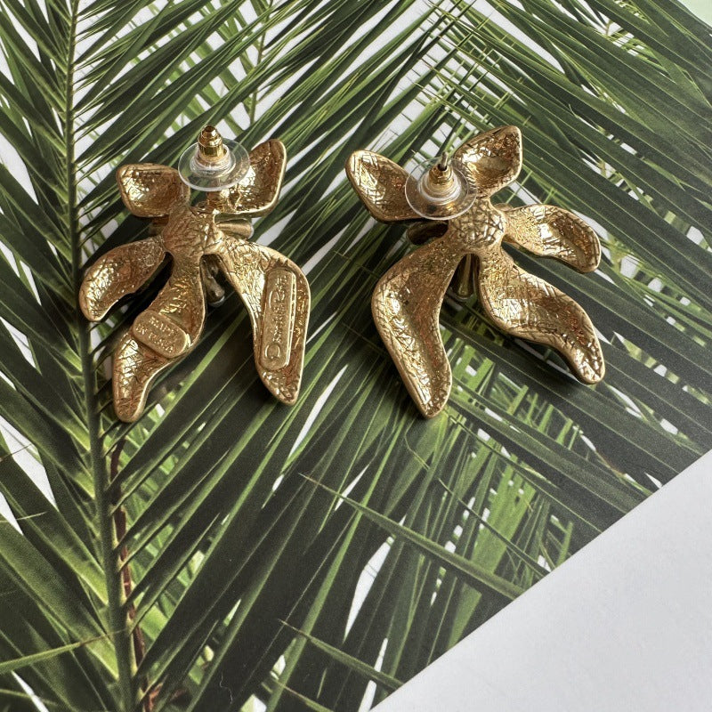 Floral enamel earrings with gold petals and pearl bead accents