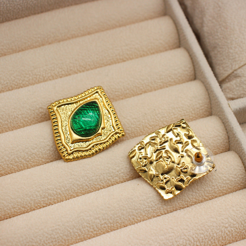 Vintage square stud earrings with green glass-like inserts; gold textured back