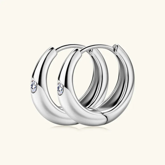 White gold teardrop huggie earrings with small round clear stones