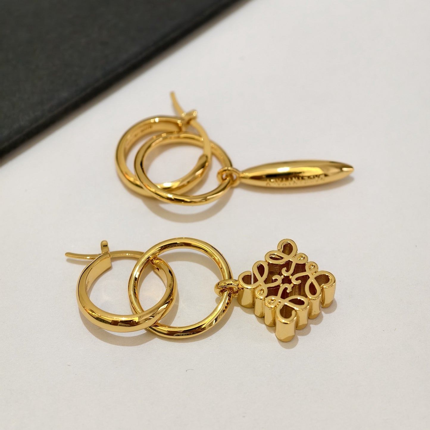 Loewe asymmetrical pendant metal earrings